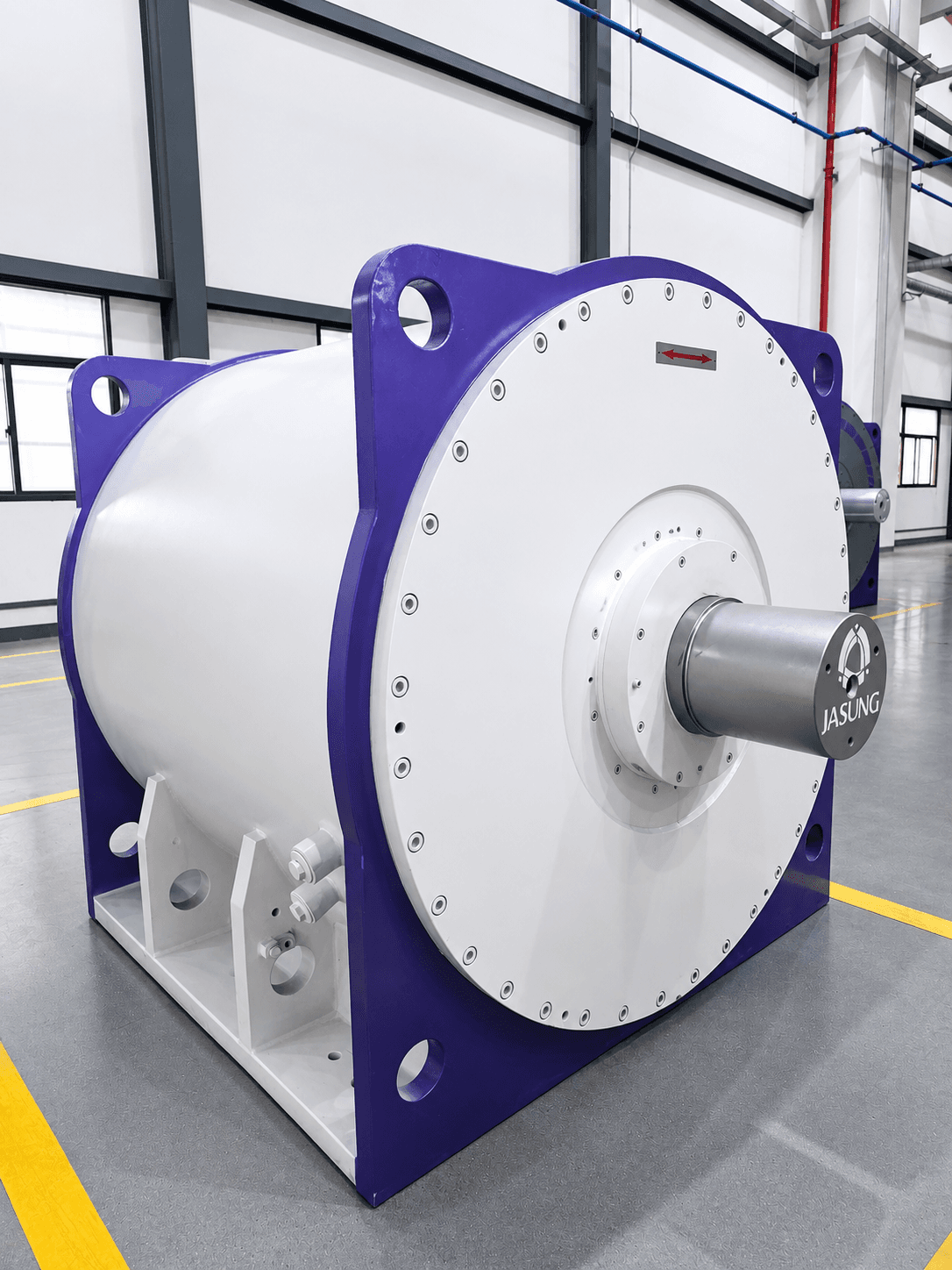 Large white and purple industrial Jasung permanent magnet motor on a factory floor.